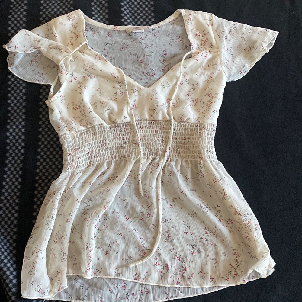 I am selling a cream color blouse. Brand: Jump.